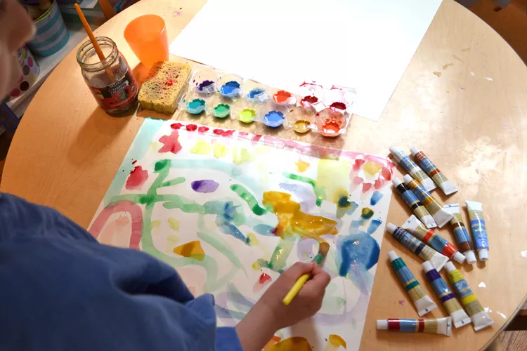 Student is painting detailed watercolor illustrate